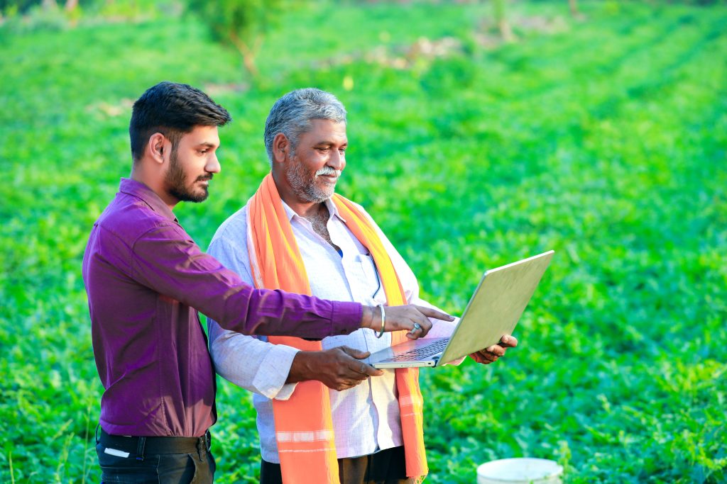 indian agronomist with farmer field